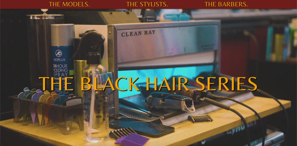 An assortment of barber shop supplies including hair trimmers, combs and hair spray.